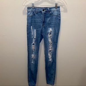 Distressed denim skinny jeans